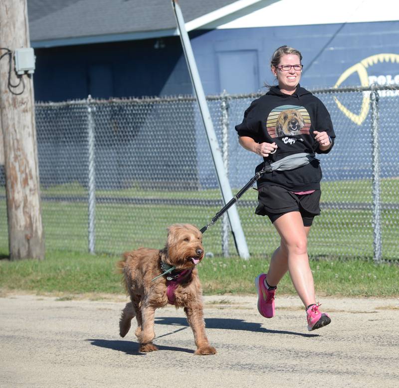 Heidi Miller of Forreston and her dog, Penny, a Goldendoodle, finished first in the 2024 Doggy Dash 5K in Polo on Saturday, Sept. 7, 2024. The event, organized and run by Polo High School's student council, raised $500 for the Happy Tails Humane Society in Rock Falls.