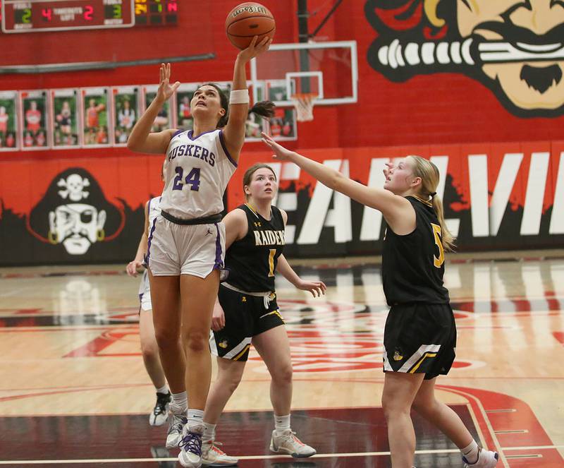 Serena's Paisley Twait eyes the hoop as Ashton-Franklin Center's Audree Dorn defends during the Class 1A Regional final on Thursday, Feb. 15, 2024 at Earlville High School.