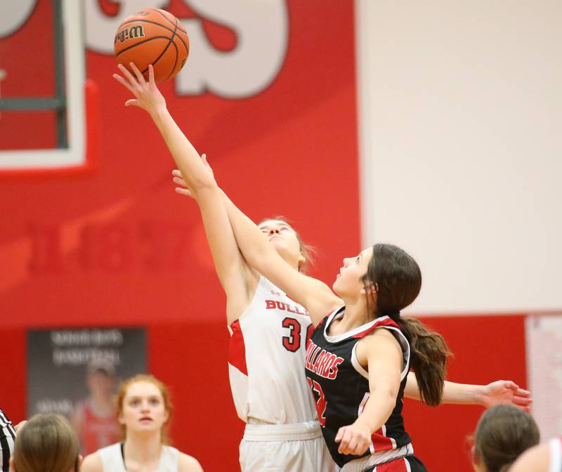 Streator's Marsia Vickers (left) wins the jump ball over Henry-Senachwine's Kaitlyn Anderson (right) on Wednesday, Jan,. 4, 2023 at Streator High School.