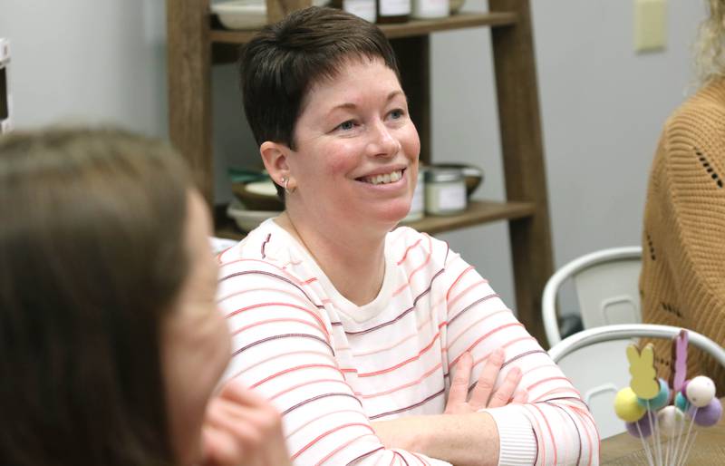 Joni Peterson, owner of 35:35 Makers Collective, talks Friday, March 18, 2022, to local artisans who will have their work available for purchase in the shop. The store, at 308 West State Street in Sycamore, is scheduled to open April 1.