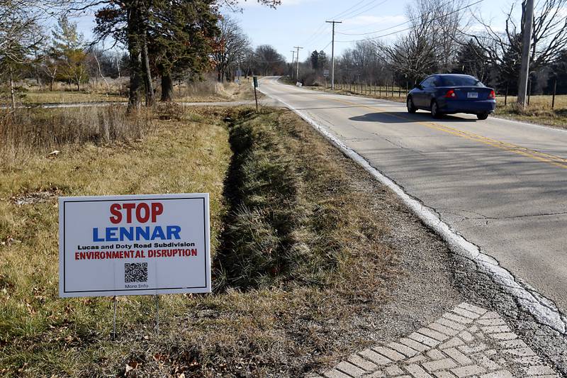 A protest sign along Lucas Road near the proposed Riverwoods neighborhood on Thursday, Jan. 4, 2024. Many neighbors have opposed the housing development.
