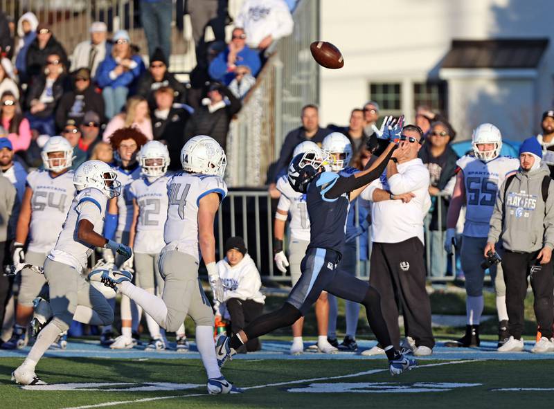 Nazareth's Jake Cestone (7) looks up for the ball and makes a catch against St. Francis during the boys varsity IHSA 5A semifinal between Nazareth Academy and St. Francis high school in La Grange Park, IL on Saturday, Nov. 18, 2023.