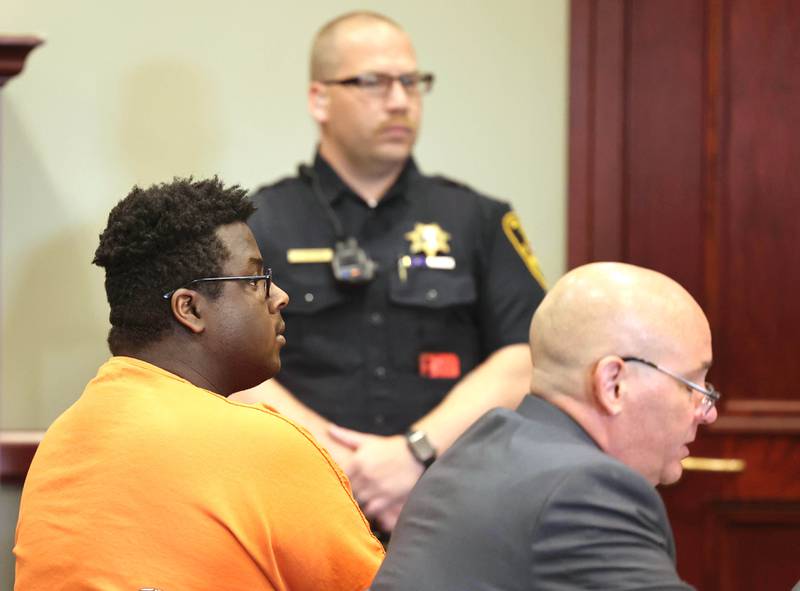 Timothy M. Doll, 29, of DeKalb, (left) and his attorney Andrew Nickel listen as Circuit Court Judge Philip Montgomery reads the charges against him Wednesday, June 14, 2023, at the DeKalb County Courthouse. Doll is being arraigned on several charges including two counts of first-degree murder in the death of 15-year-old Gracie Sasso-Cleveland of DeKalb.