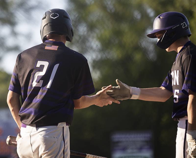 Dixon’s James Leslie and Jake Whelan celebrate against Freeport Thursday, May 23, 2024 during the Class 3A regional semifinal in Dixon.