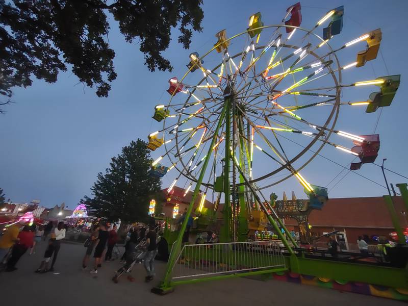 The Ferris wheel makes it rounds on the opening night of Park Fest, Friday, May 26, 2023, in downtown Streator.