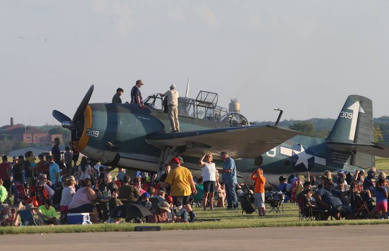 People tour a TBM Avenger aircraft during the annual TBM Avenger Reunion and Air Show on Friday, May 17, 2024 at the Illinois Valley Regional Airport in Peru.