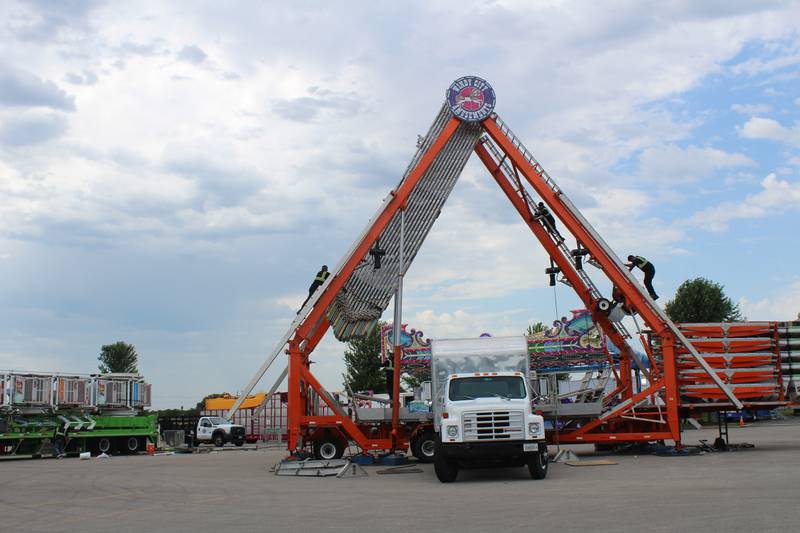 Crews pack up carnival rides after Ribfest in Lake in the Hills shut down a day early after heavy rains left the grounds waterlogged and unsafe.