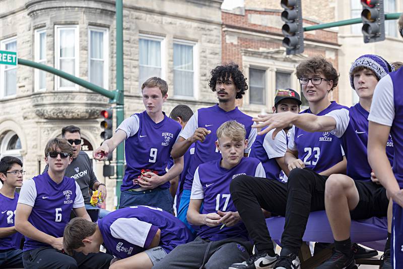 Dixon soccer players fire candy from their float Friday, Sept. 29, 2023.