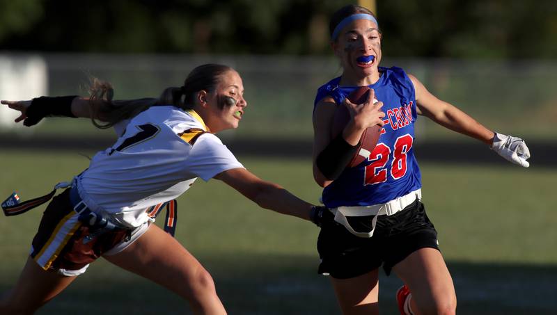 Dundee-Crown’s Kerrigan Svec, right, tries to get past Jacobs’ Ella Edgerton in varsity flag football on Tuesday, Sept. 3, 2024, at Dundee-Crown High School in Carpentersville.