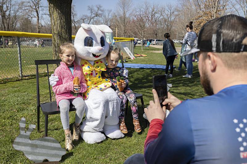 Capri (left), 6, and Paisley Lehman, 4, have their photo taken by dad Zach Thursday, April 6, 2023 during the Dixon Park District egg hunt. The hunt was held at the Al Morrison baseball diamonds.