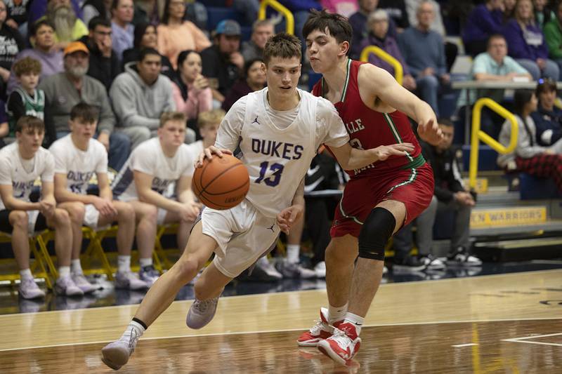 Dixon’s Cullen Shaner drives against LaSalle-Peru’s Eric Sotelo Wednesday, Feb. 21, 2024 at the Sterling class 3A basketball regional.