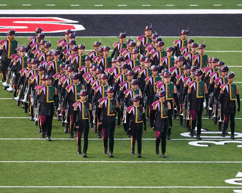 The Madison Scouts of Madison, Wisconsin, take the field at the start of their performance during the Drum Corps International Midwest Classic on Saturday, July 13, 2024, at Northern Illinois University Huskie Stadium in DeKalb.