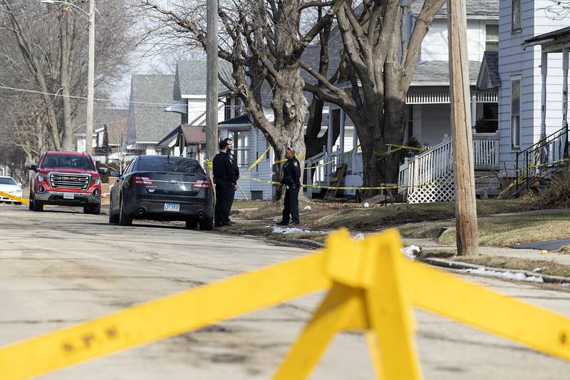 Investigators work at the scene Monday, Feb. 20, 2023 of a Sunday night shooting in the 1100 block of 4th Ave. in Sterling. One victim was pronounced dead with four taken into custody.