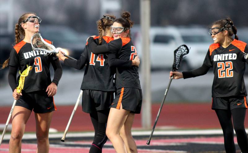 Crystal Lake Central’s Tigers celebrate an Addison Bechler first-half goal in varsity lacrosse at Huntley Wednesday.