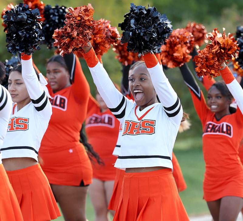 DeKalb High School cheerleaders head down Dresser Road Wednesday, Oct. 5, 2022, during the school's homecoming parade.