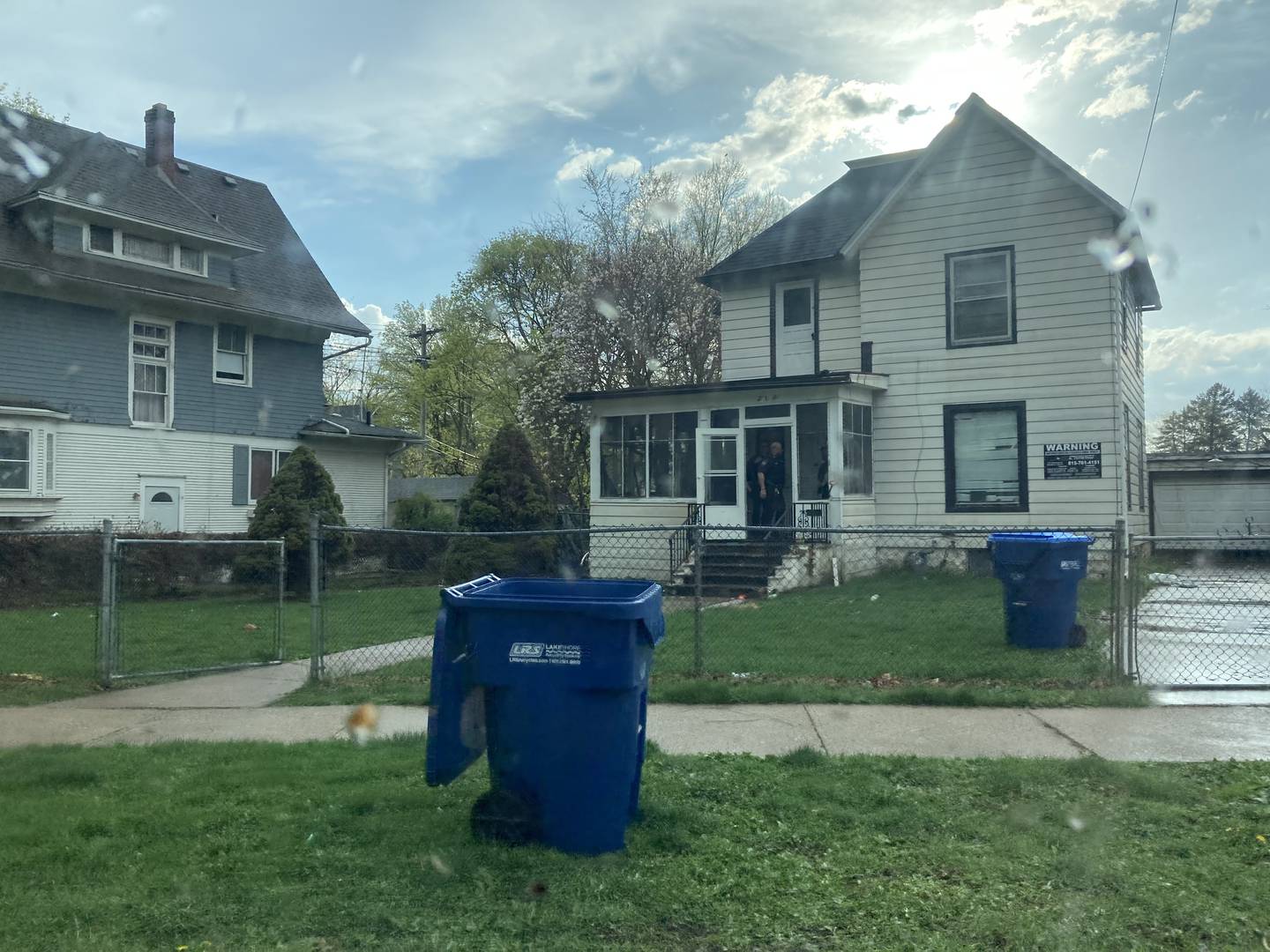 DeKalb police officers can be seen searching a home in the 200 block of College Avenue, DeKalb, around 5 p.m. Thursday, April 20, 2023. Police arrested two men at the residence. One of them is accused of robbing of a Vinny's Pizza delivery person earlier that day.