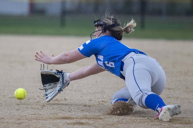 Newman’s Sam Ackman makes a diving stop for an out against Dixon Thursday, April 11, 2024 at Reynolds Field in Dixon.