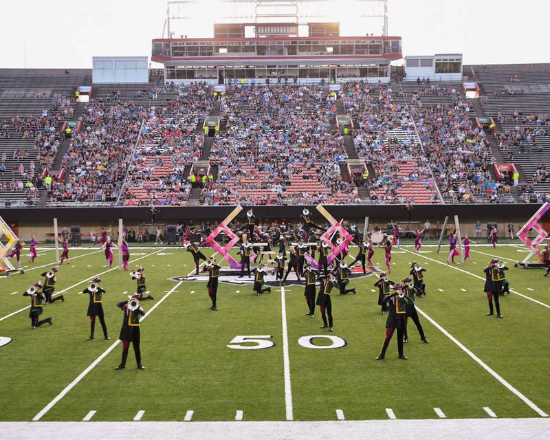 The Madison Scouts of Madison, Wisconsin perform to a large crowd during the Drum Corps International Midwest Classic on Saturday, July 13, 2024, at Northern Illinois University Huskie Stadium in DeKalb.