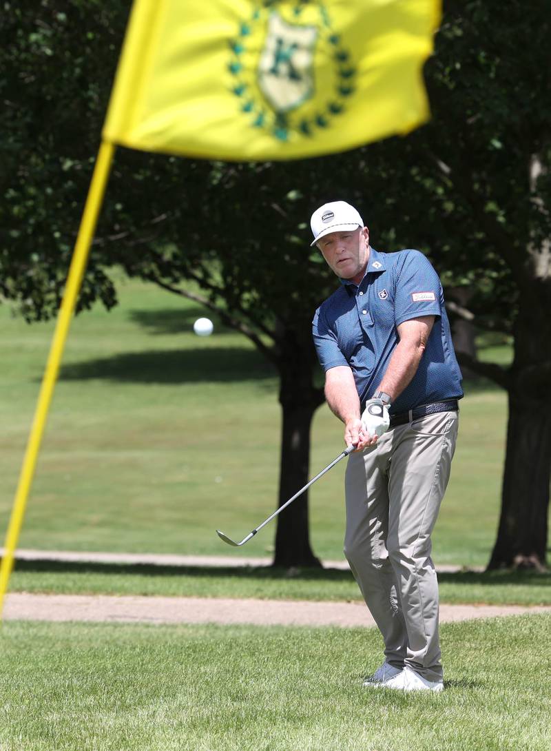 David Paeglow, head golf pro at Kishwaukee Country Club, chips onto the 18th green Thursday, June 6, 2024, at the country club in DeKalb. Paeglow will be competing in the U.S. Senior Open later this month.