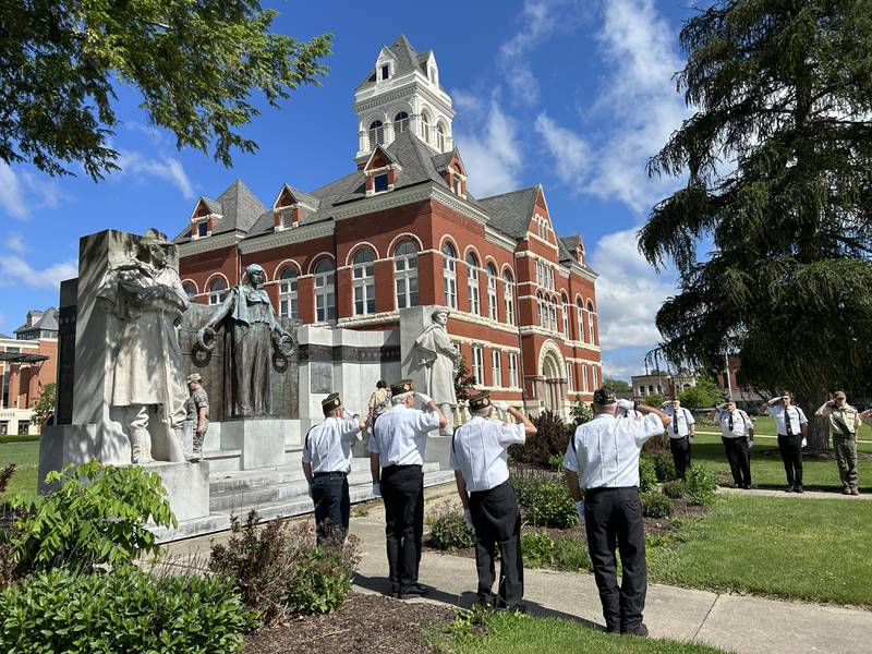 Oregon VFW members salute as two wreathes are placed on Lorado Taft's Soldier and Sailor Monument on the Ogle County Courthouse Lawn as part of  Memorial Day services in Oregon on Monday, May 27, 2024.