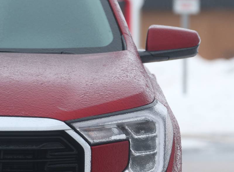 A small glaze of ice forms on a pickup truck on Monday, Jan. 22, 2024 in Peru.