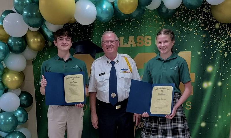 St. Charles American Legion Post 342 member Mike Foulkes presents St. Patrick Catholic School students William Starkovich and Grace Kennedy with the American Legion School Award at the 8th grade awards ceremony on May 10, 2024.
(From left: Starkovich, Foulkes and Kennedy)