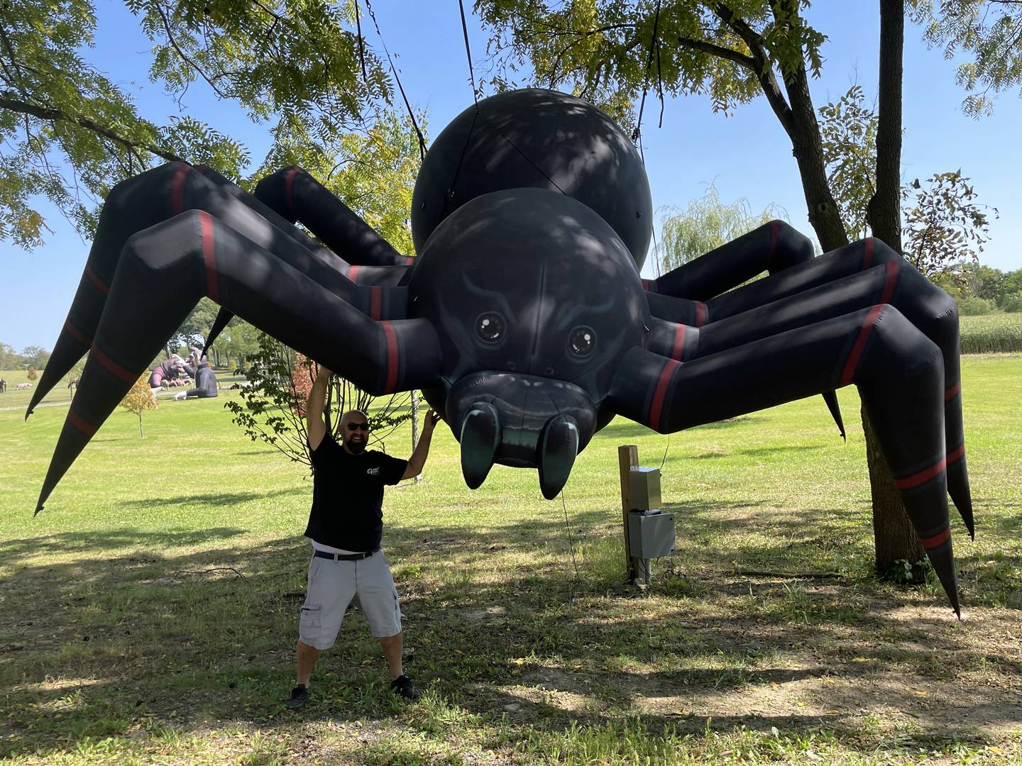 Volo Museum Director Brian Grams said this dangling, giant spider marks the entry to the first realm of Halloween Town, a place Halloween Experience trolley tour-goers will explore Sept. 20-Nov. 3 at the Volo Museum.