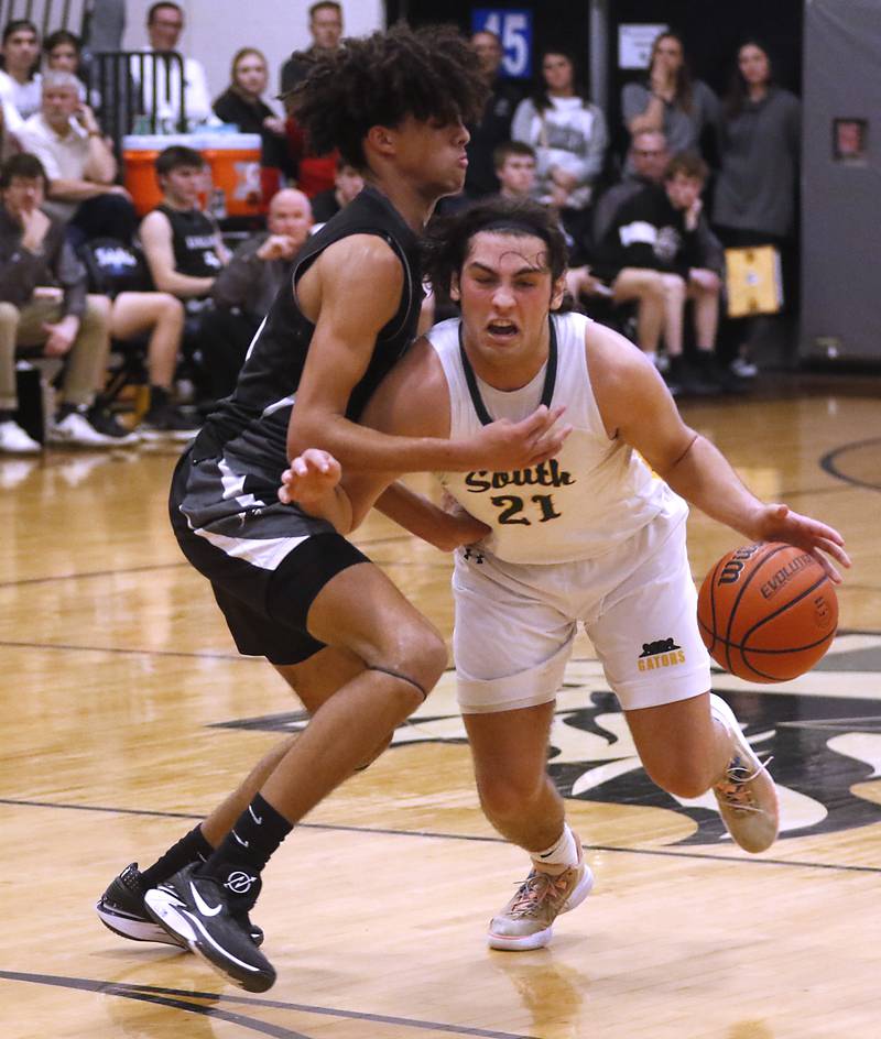 Crystal Lake South's Michael Prokos pushes the ball up the court against Kaneland's Evan Frieders during the IHSA Class 3A Kaneland Boys Basketball Sectional championship game on Friday, March 1, 2024, at Kaneland High School in Maple Park.