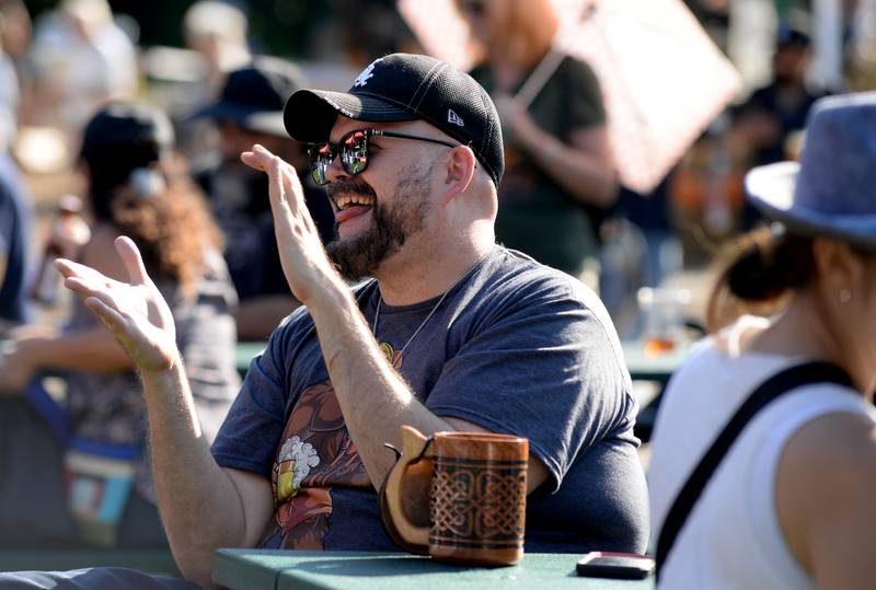 Bob Brida of Oak Lawn enjoys the music performed by Alpine Thunder during the Octoberfest held at Brookfield Zoo Saturday, Sept. 23, 2023.