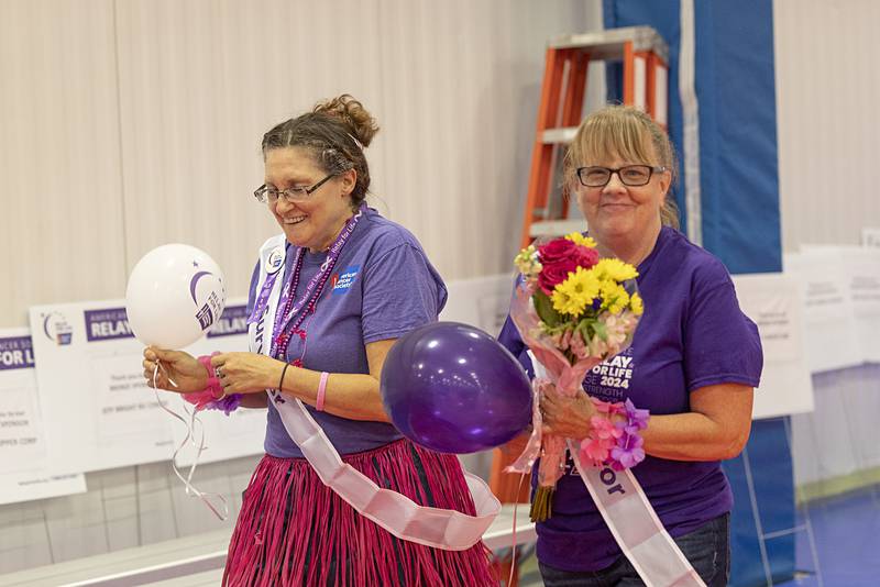 Honorary survivor Angel Eigsti (right) walks with Trista Miller on the “Survivor’s Lap” Saturday, June 8, 2024 at the Relay for Life. A group from the Walmart store in Sterling formed a team for the fundraiser.