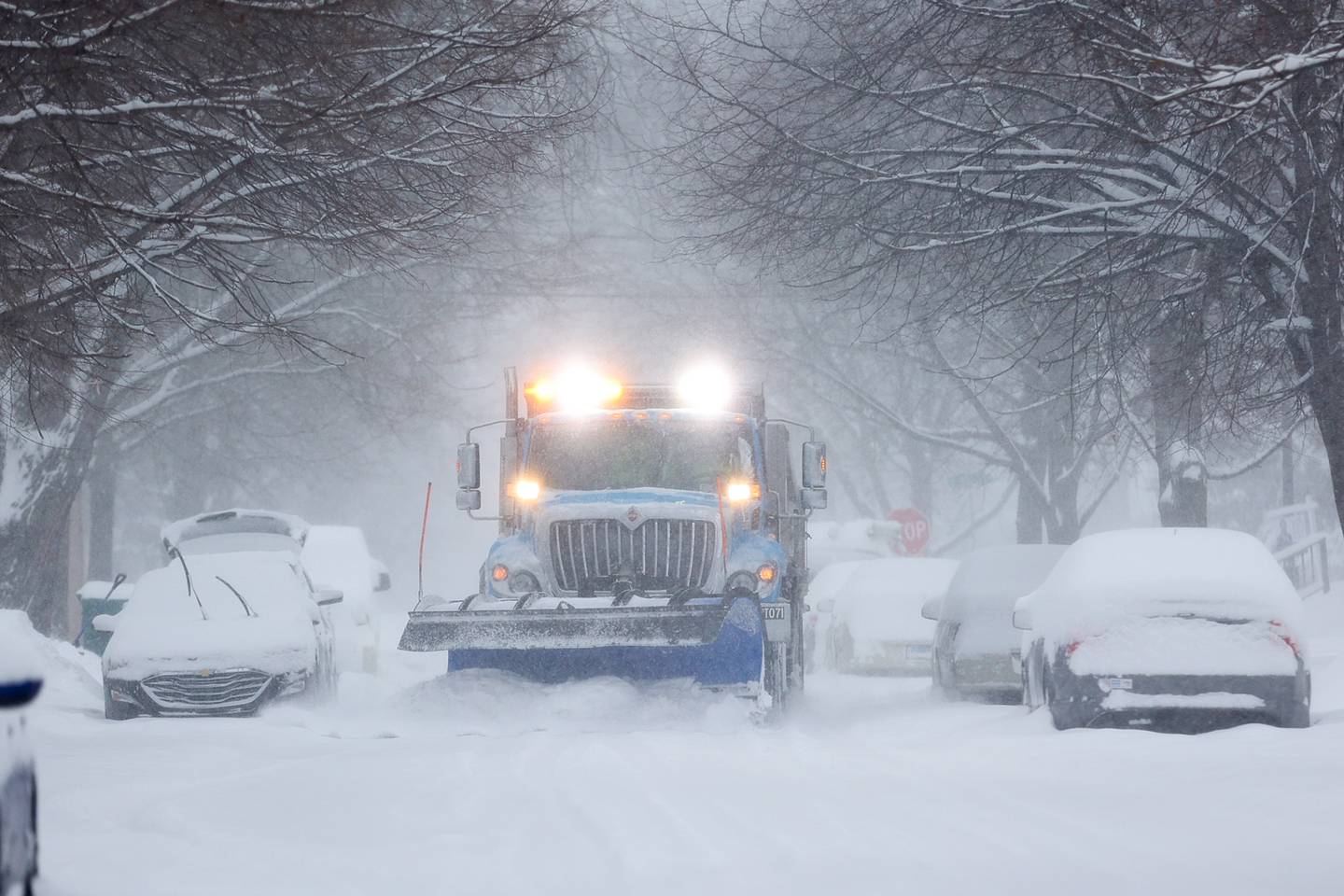 A snow plow clears Oneida Street. Wednesday, Feb. 2, 2022, in Joliet.