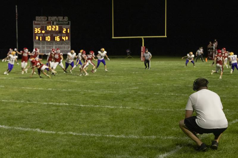 Hall High School head coach Logan Larson looks on as Hall pushes the ball closer to the endzone in a game against Mendota High School at Richard Nesti Stadium on September 13, 2024.