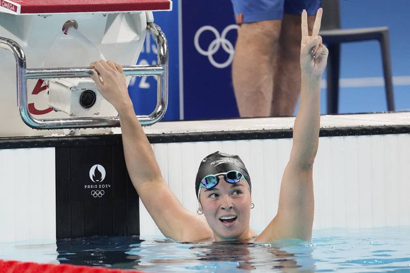 Palestine's Valerie Rose Tarazi celebrates after finishing a women's 200-meter individual medley heat at the Summer Olympics in Nanterre, France, Friday, Aug. 2, 2024. (AP Photo/Ashley Landis)