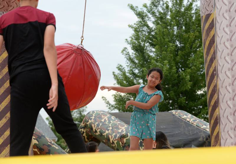 Alexia Galdindo of Cicero plays the Wrecking Ball while attending the District 99 Back to School Fair at the Cicero Community Park Sunday Aug 13, 2023.