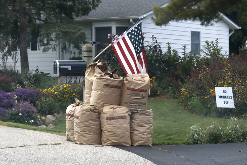 Bagged yard waste In the 12200 block of  Manor Lane in McHenry Monday, Oct. 9, 2023. Many municipalities are just starting to pick up leaves.