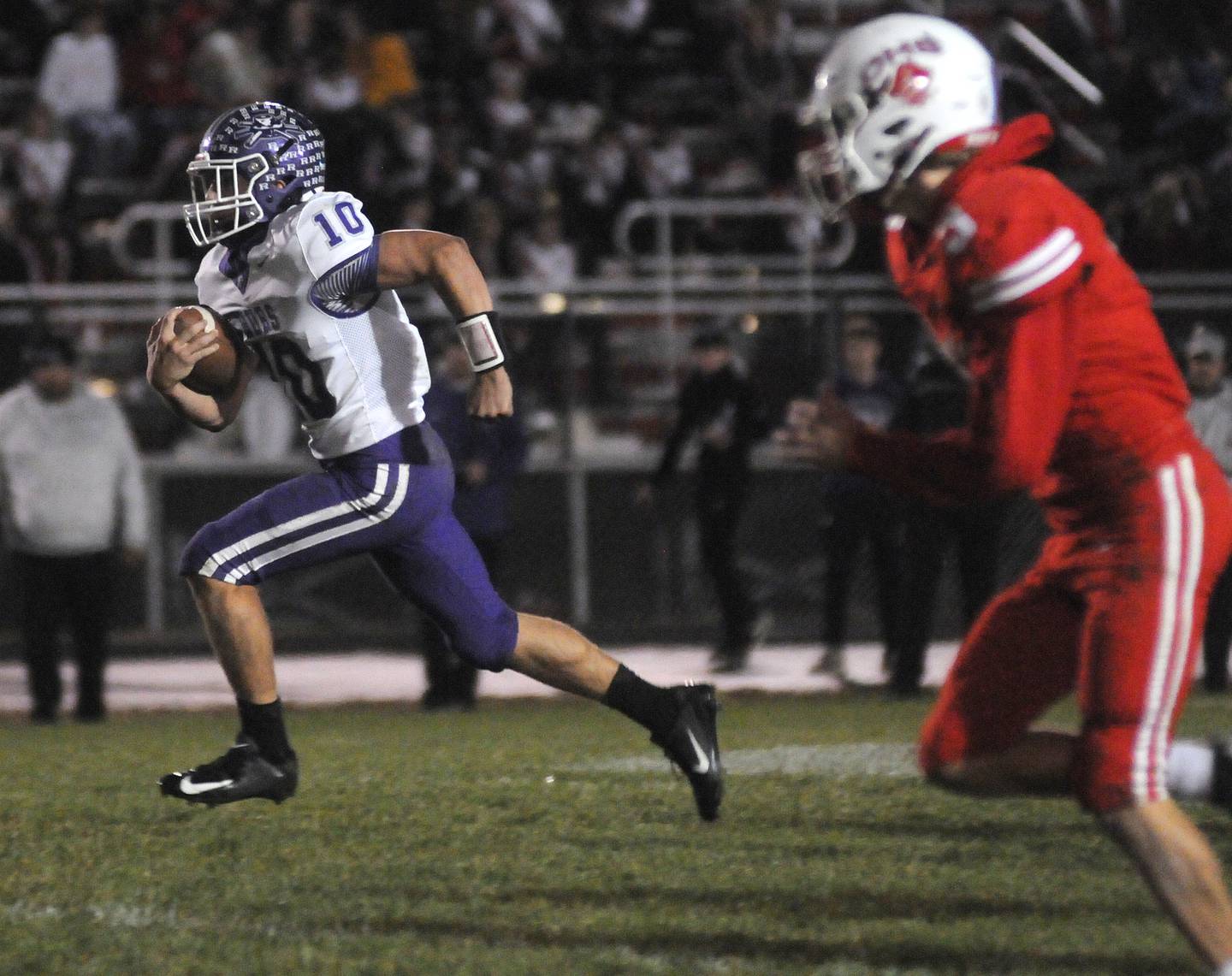 Rochelle's Dylan Manning takes off for a touchdown past Ottawa's George Shumway at King Field on Friday, Oct. 18, 2024.