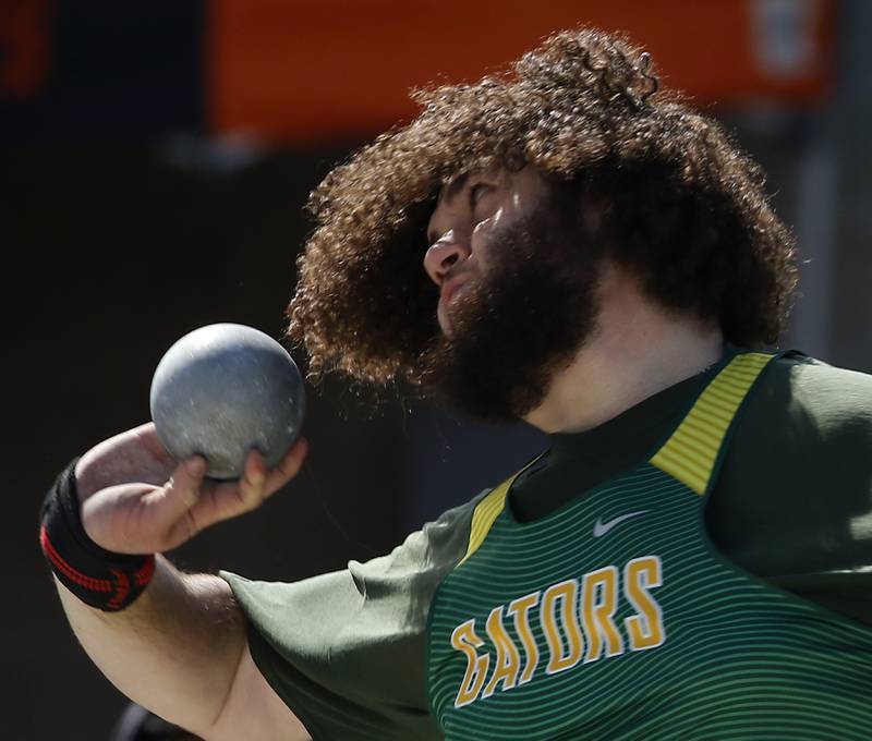 Crystal Lake South’s Ryne Salas throws the shot putt Friday, April 21, 2023, during the McHenry County Track and Field Meet at Cary-Grove High School.