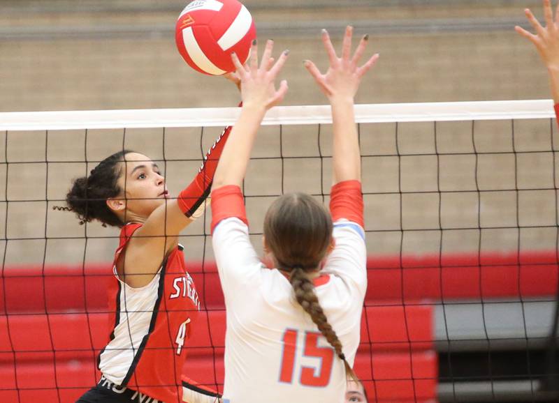 Streator's Sonia Proksa sends the ball past Ottawa's Addison Duggan on Thursday, Aug. 29, 2024 in Kingman Gym at Ottawa High School.