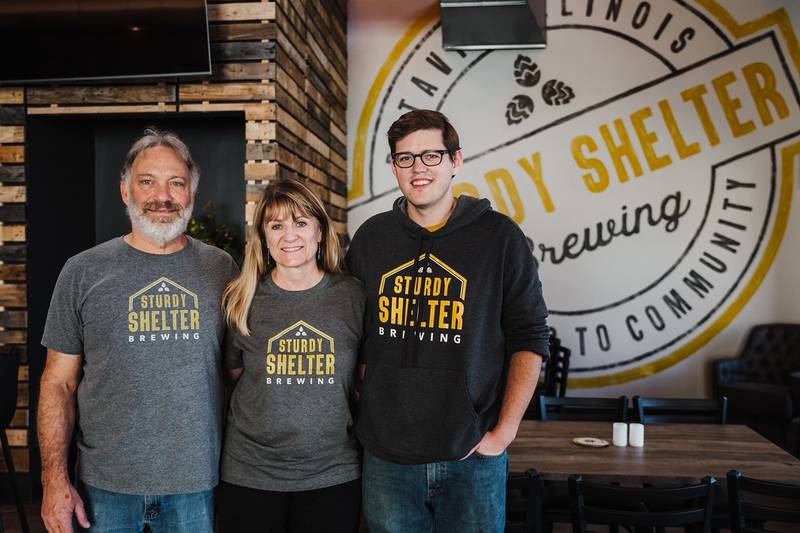 Owners Frank and Diane Mercadante of Sturdy Shelter Brewing in downtown Batavia, along with General Manager Oliver Bulley (far right).