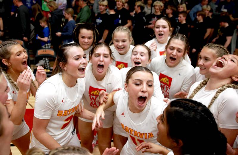 Batavia players celebrate their Class 4A Batavia Sectional final win over Geneva on Thursday, Feb. 22, 2024.