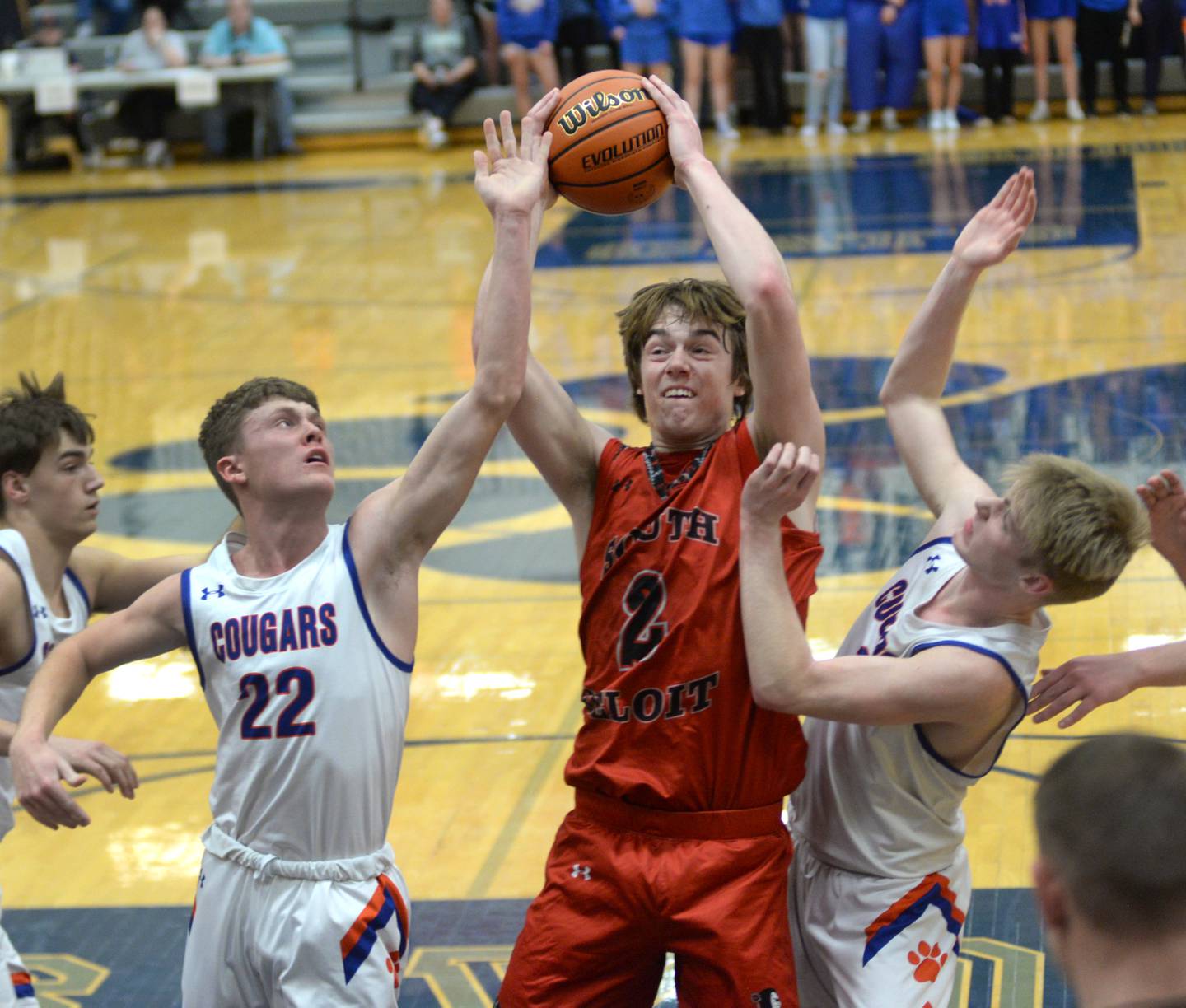 South Beloit's Ross Roberston (2) brings down a defensive rebound between Eastland's Braden Anderson (22) and Trevor Janssen (11) on Tuesday, Feb. 27, 2024 at the 1A River Ridge Sectional.