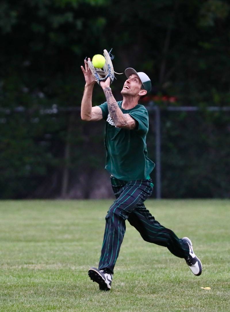 Michael Murray of St. Mathews snags a fly ball during championship night of the Princeton Princeton Park District Fastpitch tournament.