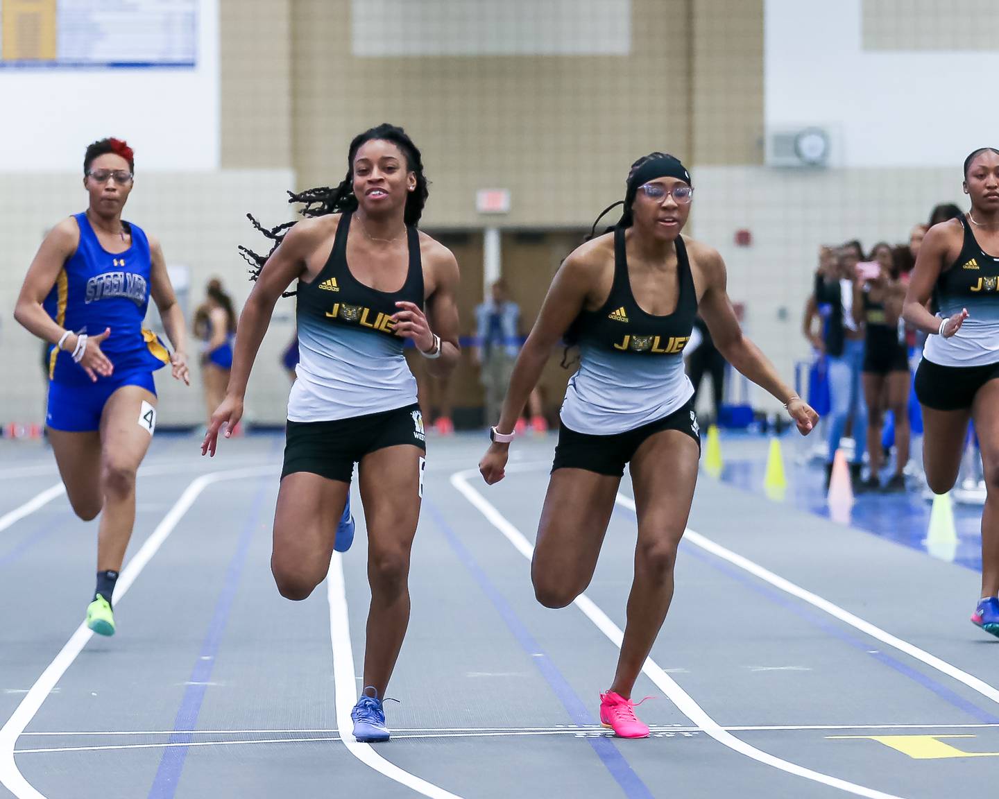 Morgan Pork (3) edges out Jerie McClellan (2) in the 55 meters at the Joliet Central track meet.  March 8, 2023.
