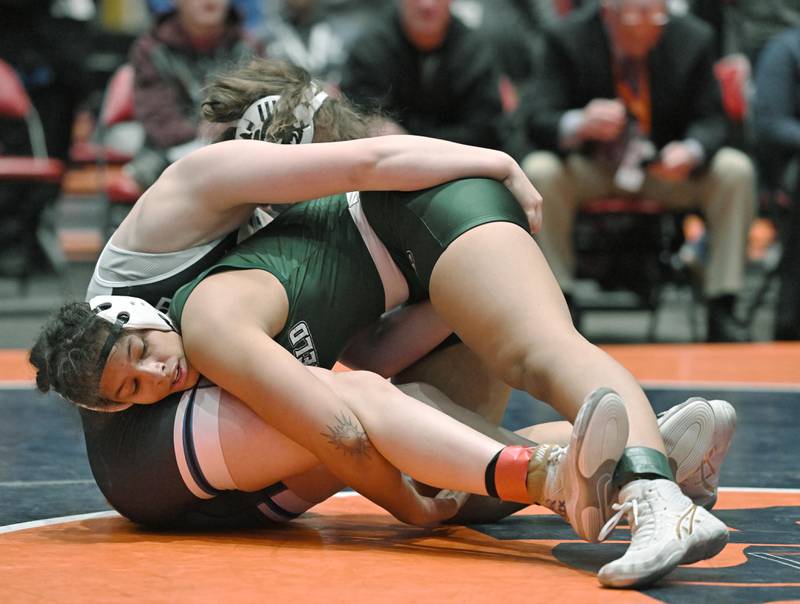 coach as she wrestles Peotone’s Kiernan Farmer in the 170-pound class at the girls wrestling state finals at Grossinger Motor Arena in Bloomington on Saturday, Feb. 24, 2024.