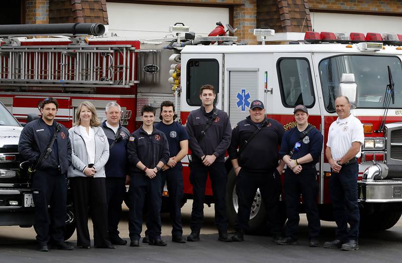 Elizabeth Depouw, second from left, the EMS manager at Northwestern Medicine, poses with firefighters and emergency medical technicians at the Spring Grove Fire Department, where she taught a session about dealing with sepsis on March 28, 2024.