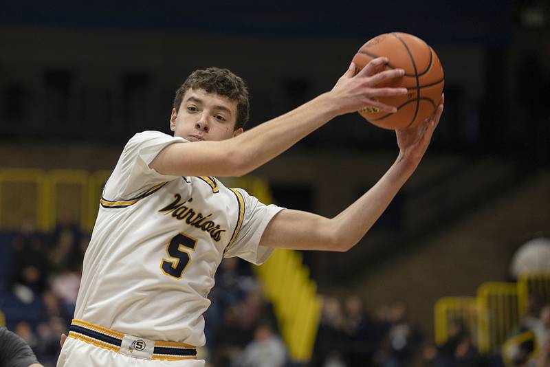 Sterling’s Trevor Dir pulls in a rebound Friday, Jan. 6, 2023 against Geneseo.