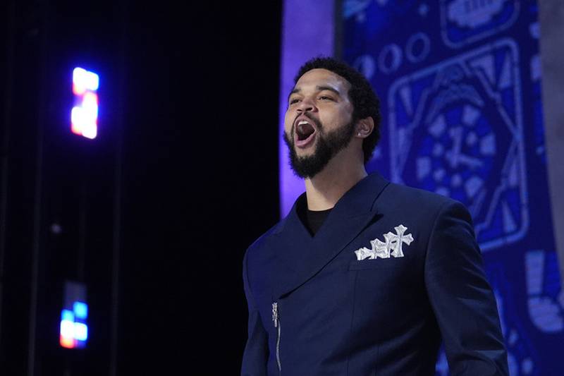 Southern California quarterback Caleb Williams walks on stage before the first round of the NFL football draft, Thursday, April 25, 2024, in Detroit.