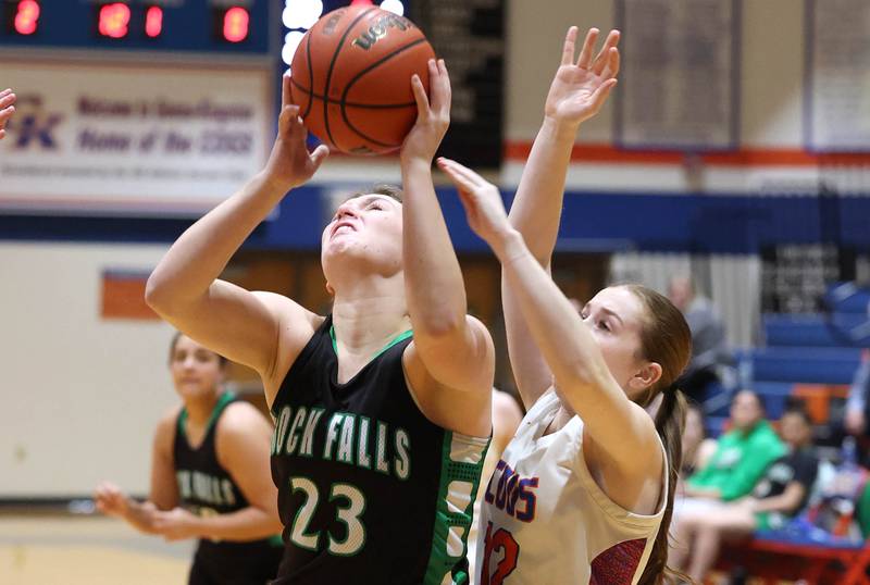 Rock Falls' Claire Bickett gets up a shot in front of Genoa-Kingston's Ally Poegel during their game Friday, Feb. 2, 2024, at Genoa-Kingston High School.