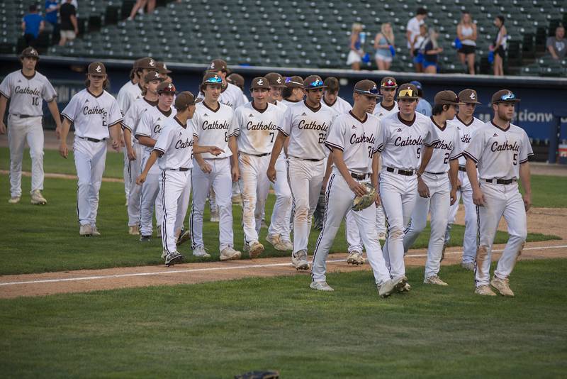 Joliet Catholic walks off the field after defeating Columbia 4-1 Friday, June 3, 2022 during the IHSA Class 2A baseball state semifinal.