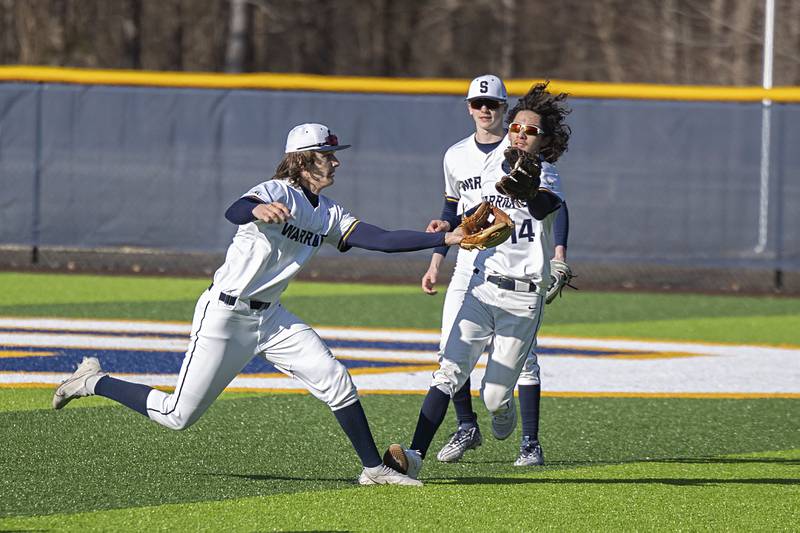 Sterling’s Miles Nawrocki (left) and Sterling’s Gio Cantu come together after a fly ball dropped just out of reach of the fielders Monday, March 27, 2023 versus Lasalle-Peru.